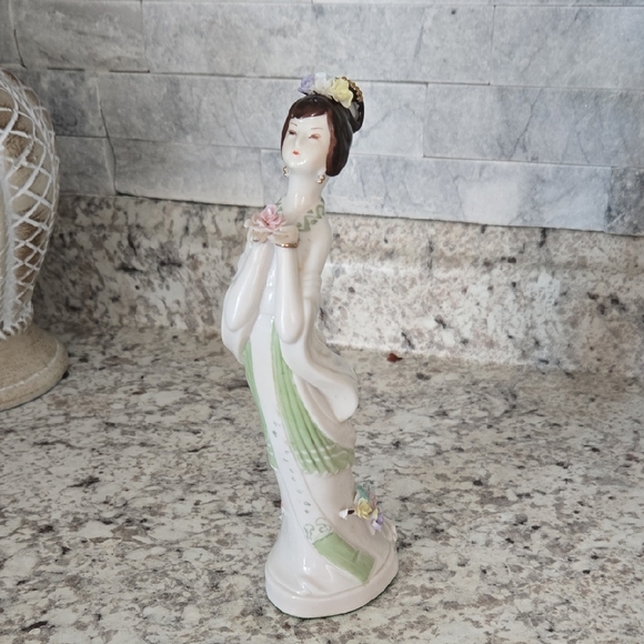 Elegant Porcelain Figurine with Floral Accents